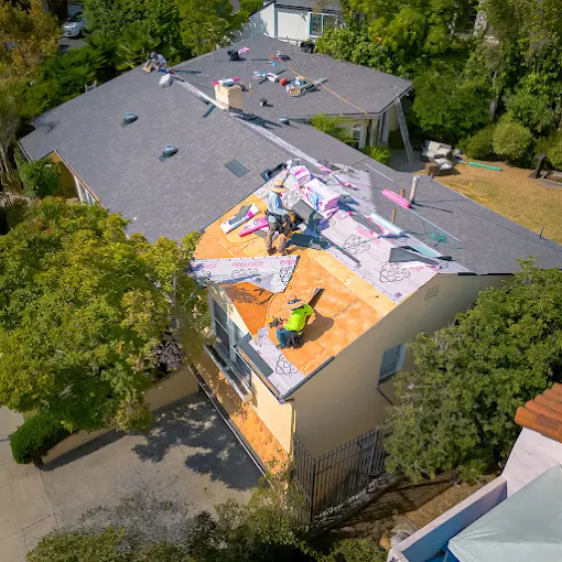 Residential roof during active replacement before completion