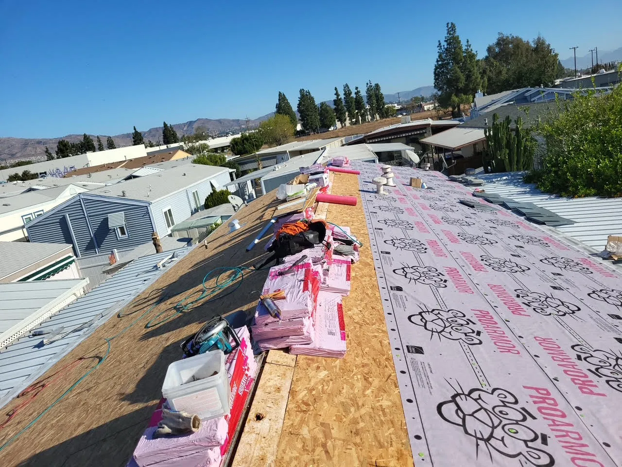 Roof repair and replacement work in progress on a residential property